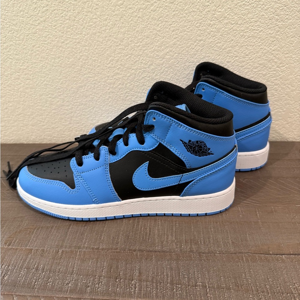 Black and blue Nike Air Jordans. Hightop sneaker size 7y
